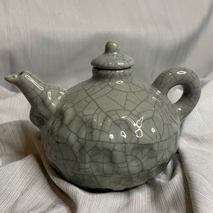 Gray ceramic glazed teapot.